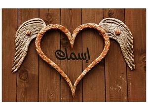 Wooden heart with wings