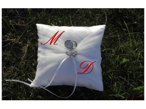 Wedding rings and white pillow
