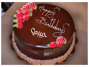 Birthday cake with red flowers