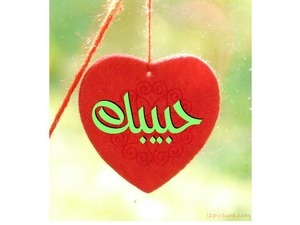 Red heart hanging on a string