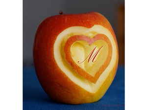 Your lover's name on the heart of an apple